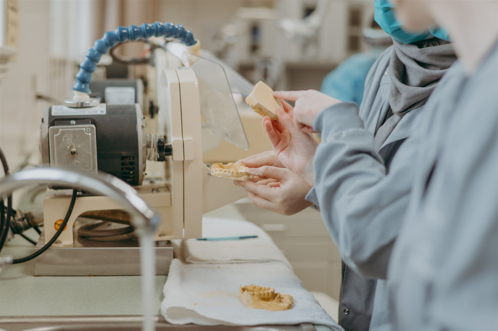 dental students working with molds of teeth