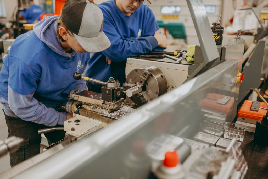 students work on cnc mill