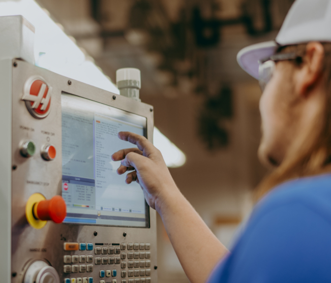 student runs cnc mill