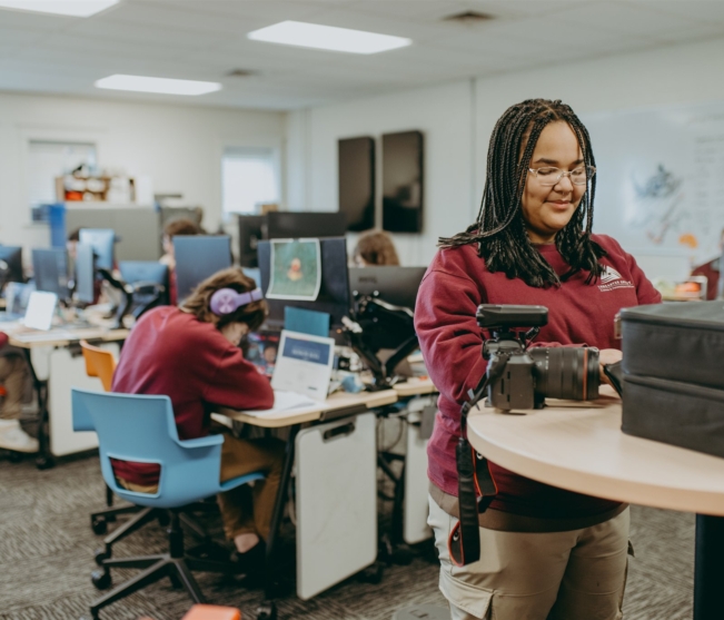 Web design student works with camera