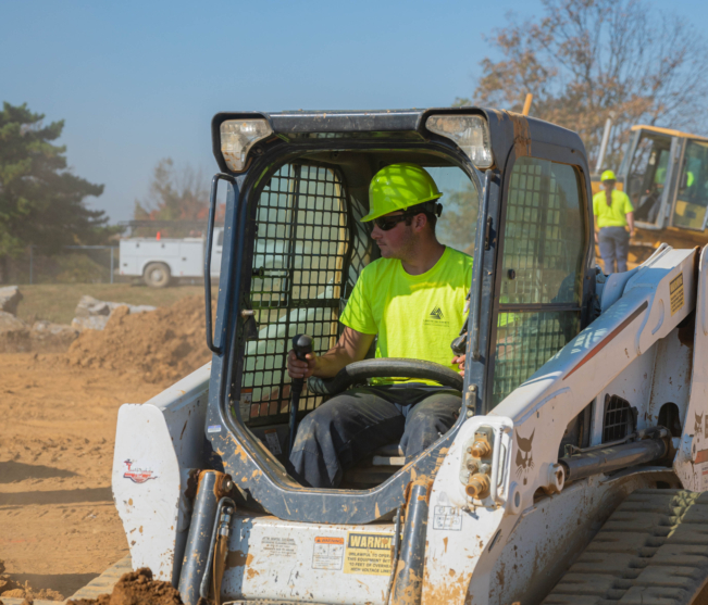 Student operates heavy equipment