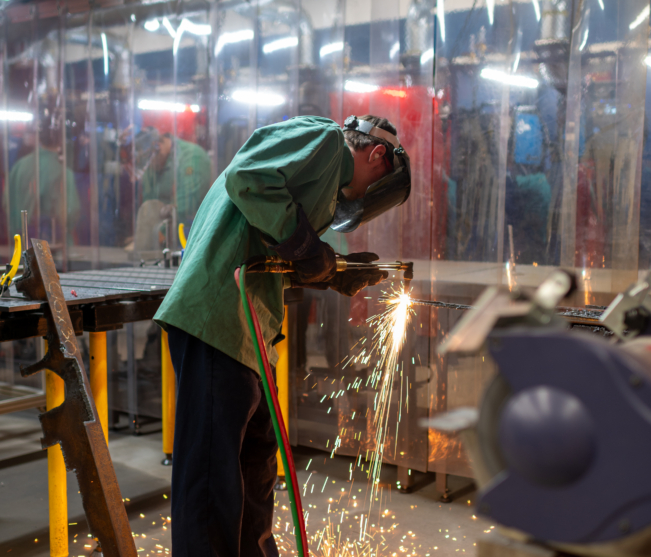 Manufacturing student cuts metal