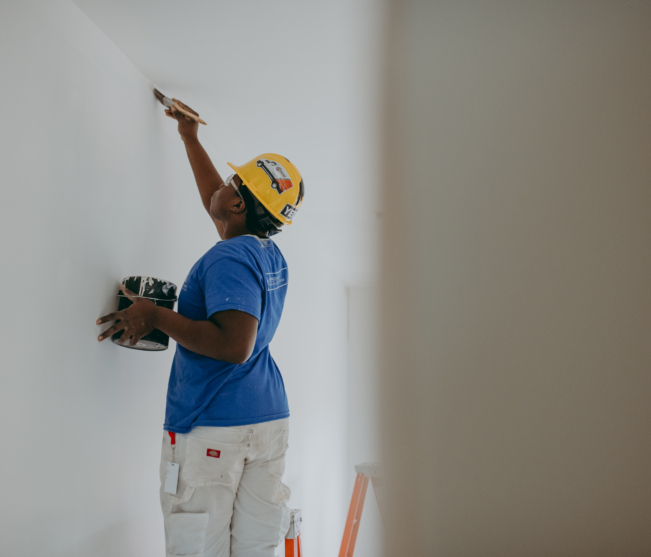Student paints wall