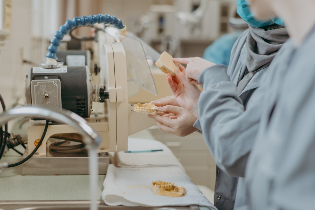 student grinds down dentures