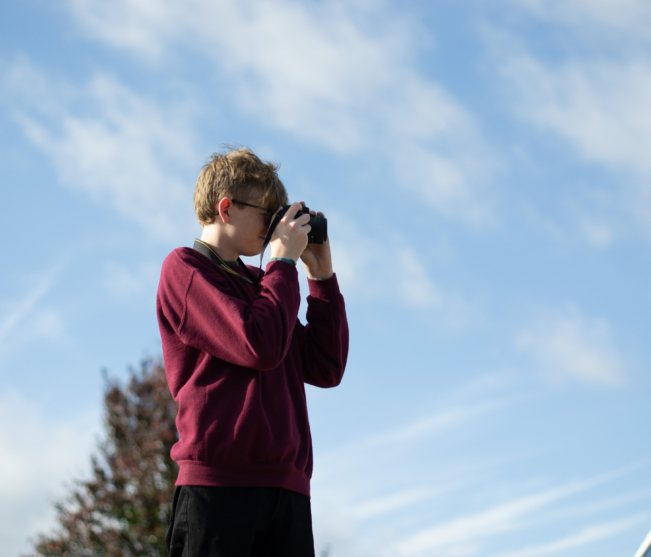 student photos a car in the parking lot