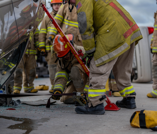 student props up car