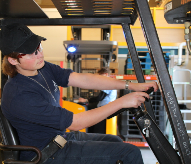 Student drives machinery