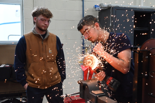 Students grind metal in Diesel Technology shop