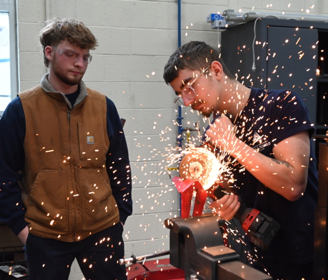 Students grind metal in Diesel Technology shop