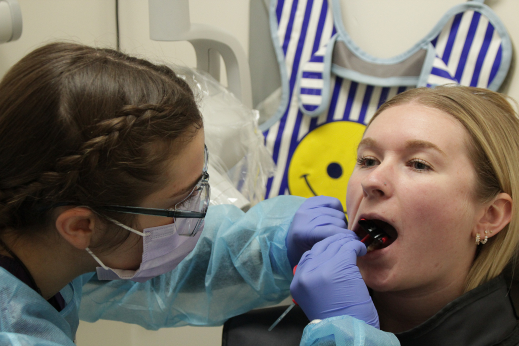 student prepares to take x-rays